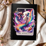 The Audacity Skeleton Mermaid Notebook – Mermaid Skeleton Riding Dragon with Rainbows and Iced Coffee Spiral Journal